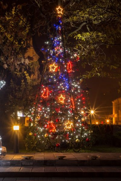 Snowman statue decorated with a lot of lights. Snowman statue decorated with a lot of lights.